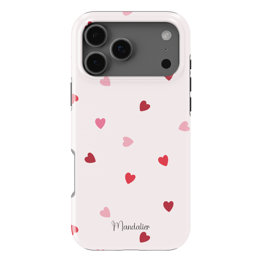 Sprinkled Hearts phone case with scattered heart print design, glossy finish, dual-layer shock-absorbing protection, available in MagSafe and tough protective options