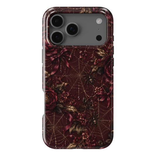 Black Cherry Web phone case featuring burgundy florals, golden spider webs, ribbons and jewel-inspired details from the After Dark Collection, available in MagSafe and Tough options