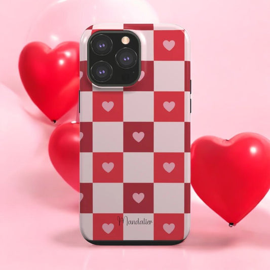 Sweetheart Plaid Tough Phone Case on a rustic table with accessories, highlighting its stylish plaid design.